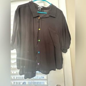 Black button up with rainbow heart buttons and a pocket. Thin flowy material.